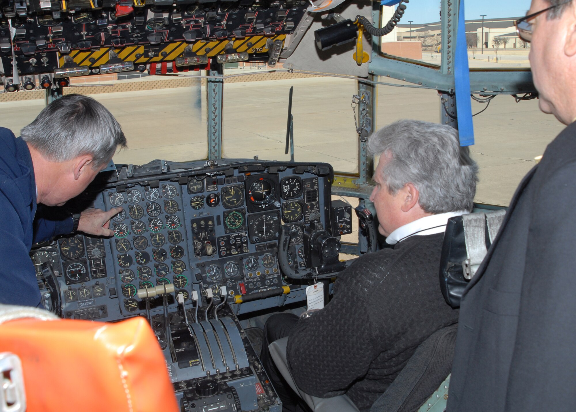 Brig. Gen. O.G. Mannon, 82nd Training Wing commander, points out the C-130 control panel to concert promoter Reed Glick and Multi Purpose Events Center Director, Bob Sullivan. The duo coordinated 1,000 free tickets that allowed base personnel and their families to attend the country music concert featuring Trace Adkins and Craig Morgan at the Kay Yeager Coliseum Feb. 21. The small group toured the 982nd Maintenance Squadron, 80th Flying Training Wing Euro NATO Joint Jet Pilot Training ramp, the Fifth Generation Maintenance Training Facility, and Hangar 1090 for some F-15 cockpit time. (U.S. Air Force/Lou Anne Sledge)