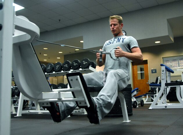 Staff Sgt. Matthew Conn works on his strength training by doing three sets of machine rows at the Fitness and Sports Center here Feb. 25. When performed properly, strength training can improve overall health including bone, muscle, tendon and ligament strength. Sergeant Conn is with the 16th Airlift Squadron. (U.S. Air Force photo/Airman Ian Hoachlander)