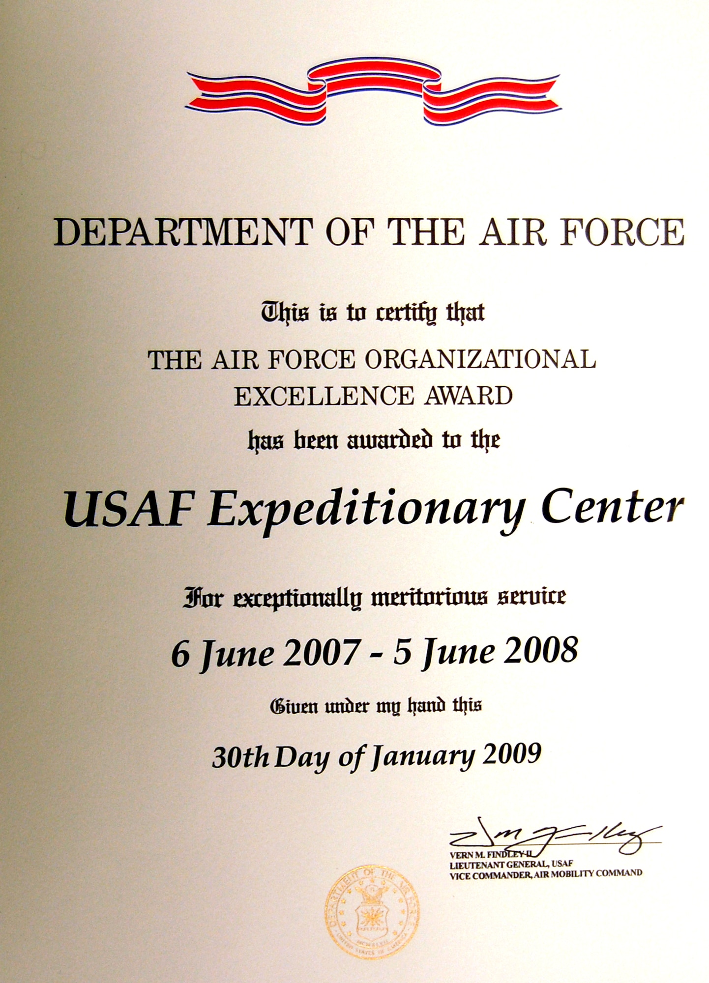 This is a photo of the signed citation for the 14th Air Force Organizational Excellence Award presented to the U.S. Air Force Expeditionary Center on Fort Dix, N.J.  The award was signed by Air Mobility Command's Vice Commander, Lt. Gen. Vern Findley.  (U.S. Air Force Photo)