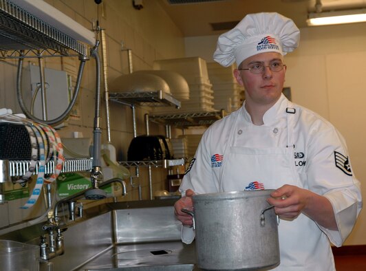 Staff Sgt. Michael Fellows, 341st Operation Support Squadron, fills a pan of water to put on the stove at the start of the annual Warrior Chef competition Feb. 19. He and his teammate Airman 1st Class Elizabeth Chapin won the fourth quarter of 2008 competition making them eligible for the annual event. (U.S. Air Force photo/Valerie Mullett)