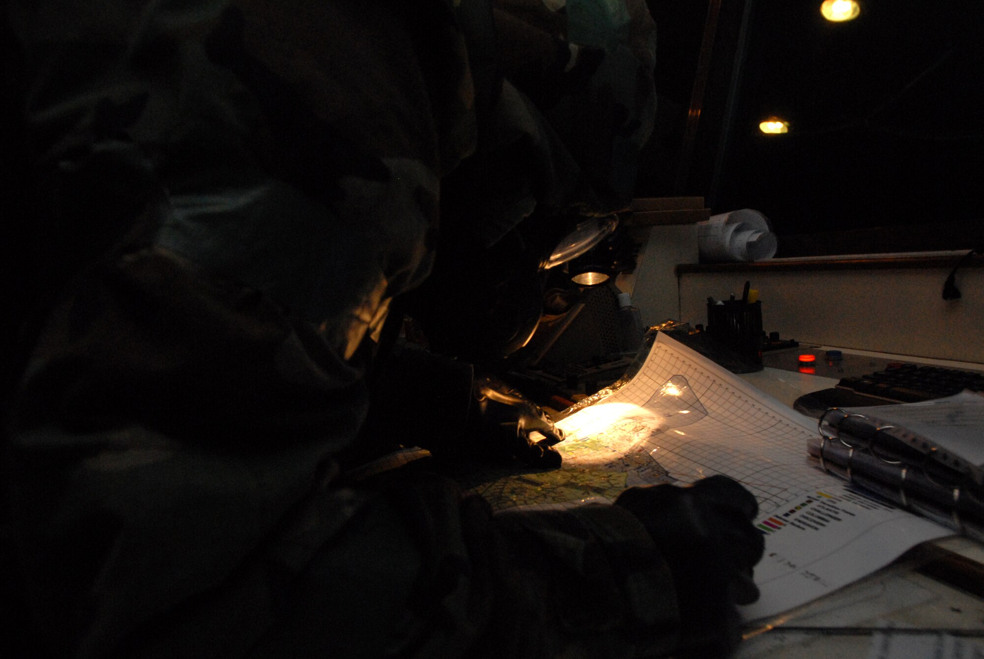 Staff Sgt. Diane Delsite, an air traffic controller from the 8th Operations Support Squadron, plots the coordinates of a missile strike on a base map before contacting emergency response agencies during the Operational Readiness Exercise Beverly Midnight 09-01 at Kunsan Air Base, Republic of Korea, Feb. 25, 2009.( US Air Force Photo By: Senior Airman Angela Ruiz)