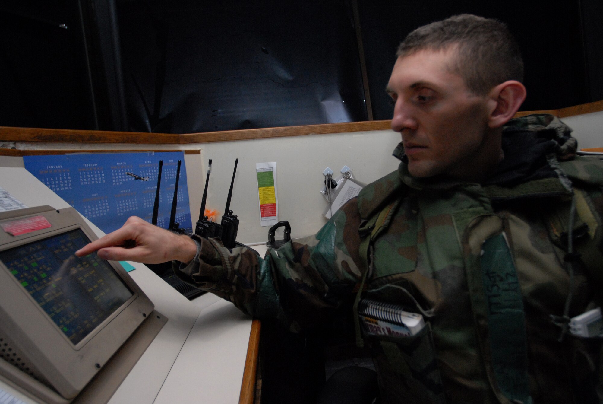Watch Supervisor, Master Sgt. Travis Utz, 8th Operations Support Squadron, uses the enhanced terminal voice switch to communicate with base agencies during the Operational Readiness Exercise Beverly Midnight 09-01 at Kunsan Air Base, Republic of Korea, Feb. 25, 2009.( US Air Force Photo By: Senior Airman Angela Ruiz)