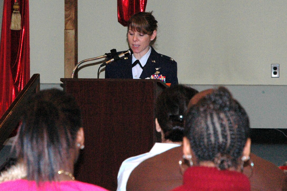 WARREN, Ohio - Air Force Reserve Colonel Cynthia Wong, the 910th Airlift Wing Inspector General, speaks with female teens at the YWCA here for a Vets for Valentines program. Also in attendance were approximately two dozen female veterans and servicewomen who shared their military experience and relics with the audience. The purpose of the event was to educate the teens while honoring the women's military service. US Air Force photo by Airman 1st Class Brenda Haines.