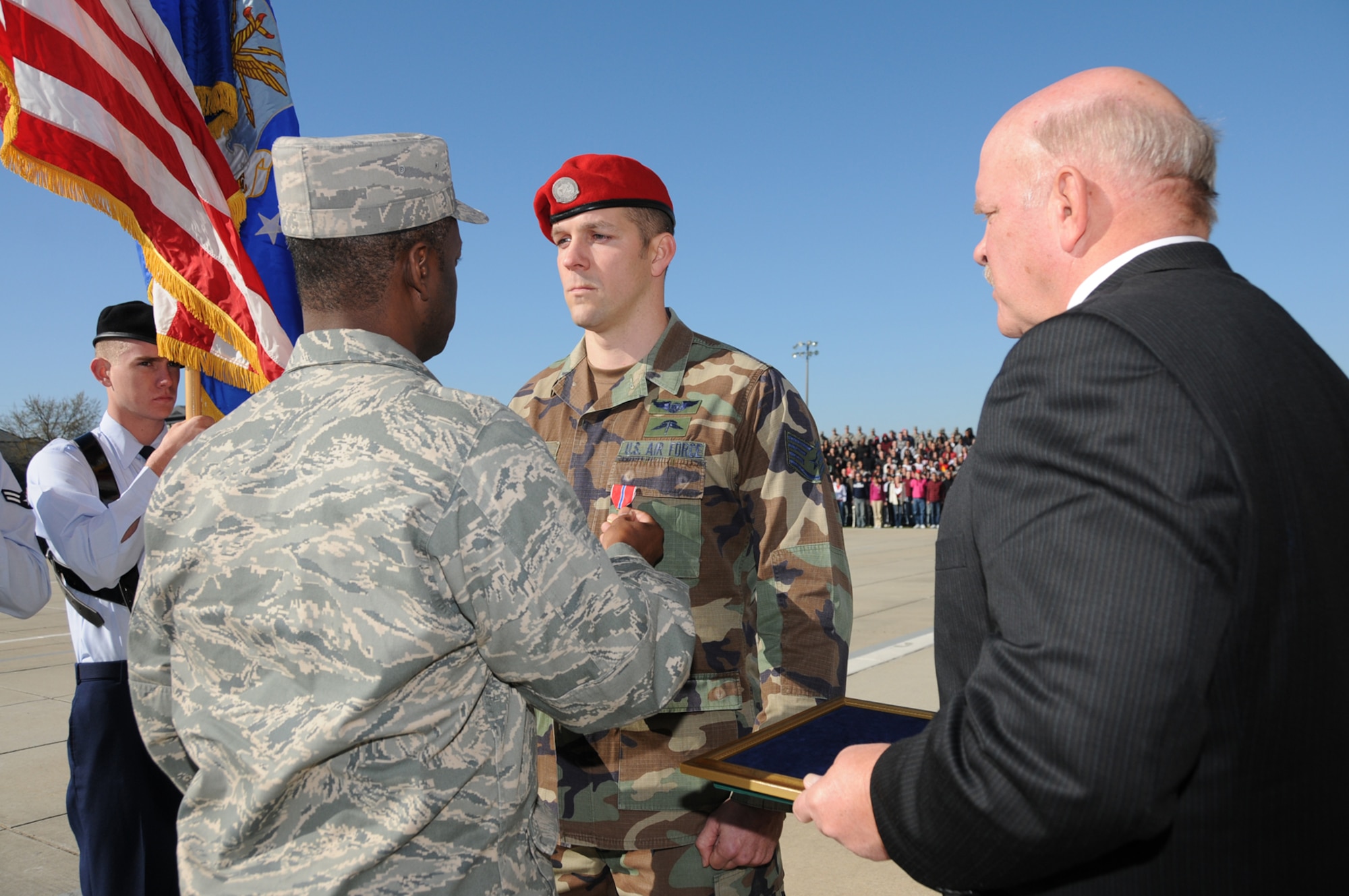 Col. Prince Gilliard, left, 81st Training Group commander, presents Sergeant Spurlin’s Bronze Star at Friday’s drill down.  (U.S. Air Force photo by Kemberly Groue)