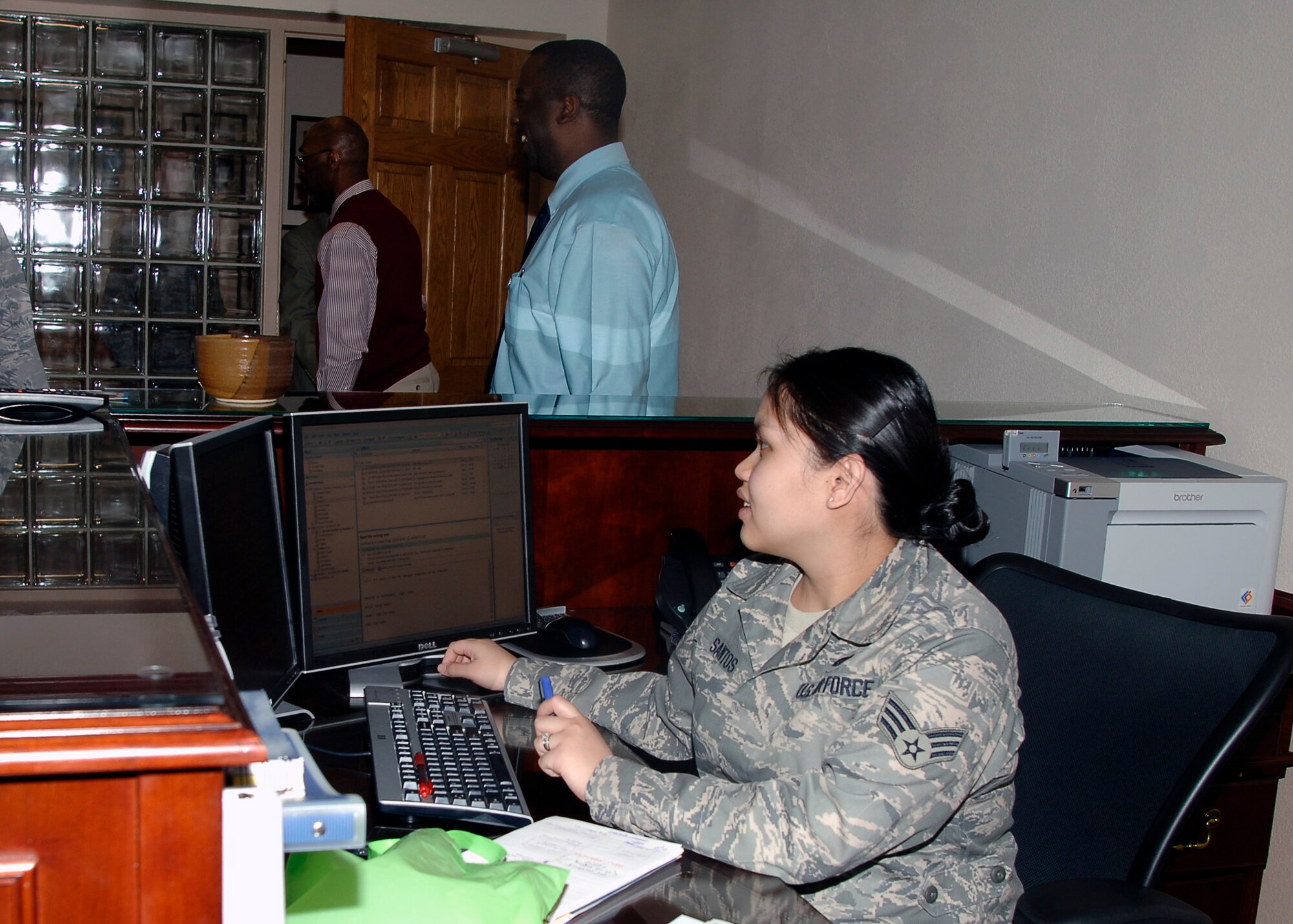 MCCONNELL AIR FORCE BASE, Kan. -- Senior Airman Rowena Santos, 22nd Air Refueling Wing, checks the leadership calendar before allowing the Wing Conference Room to be booked, Feb. 24. Before reserving wing conference room, the calendar has to be checked to ensure there are no conflicting appointments. (Photo by Senior Airman Anthony Mejia)