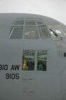 TAMPA, Florida - Reservist and Pilot, Captain Travis Adams waves from the cockpit of  a C-130H during a re-fueling stop at McDill Air Force Base.  The Youngstown Air Reserve Station took part in an Aerial Spray Certification Course in Ft. Myers, Florida.  