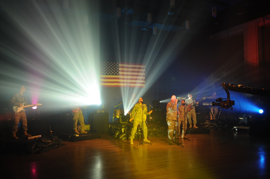 Max Impact, the United States Air Force Band’s rock group, records a video for their latest musical creation, “Locked and Loaded,” Feb. 24 at Hangar 2 on Bolling. The music video is part of Max Impact’s call “to motivate and inspire the newest generation of professional Airmen.” For more information, log on to www.usafband.af.mil. (U.S. Air Force photo by Staff Sgt. Christopher Mills)