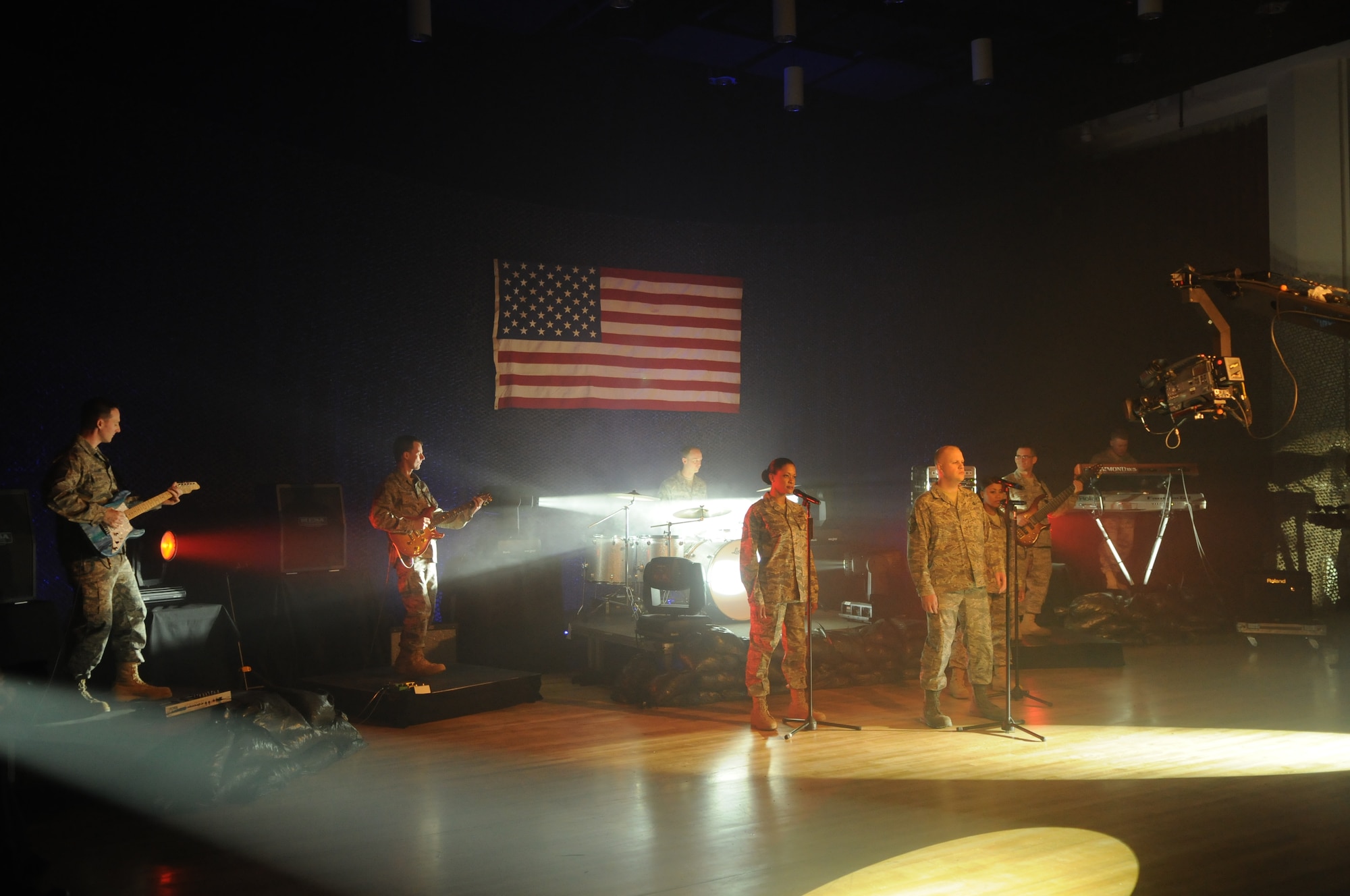 Max Impact, the United States Air Force Band’s rock group, records a video for their latest musical creation, “Locked and Loaded,” Feb. 24 at Hangar 2 on Bolling. The music video is part of Max Impact’s call “to motivate and inspire the newest generation of professional Airmen.” For more information, log on to www.usafband.af.mil. (U.S. Air Force photo by Staff Sgt. Christopher Mills)