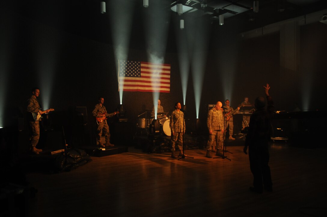 Max Impact, the United States Air Force Band’s rock group, records a video for their latest musical creation, “Locked and Loaded,” Feb. 24 at Hangar 2 on Bolling. The music video is part of Max Impact’s call “to motivate and inspire the newest generation of professional Airmen.” For more information, log on to www.usafband.af.mil. (U.S. Air Force photo by Staff Sgt. Christopher Mills)
