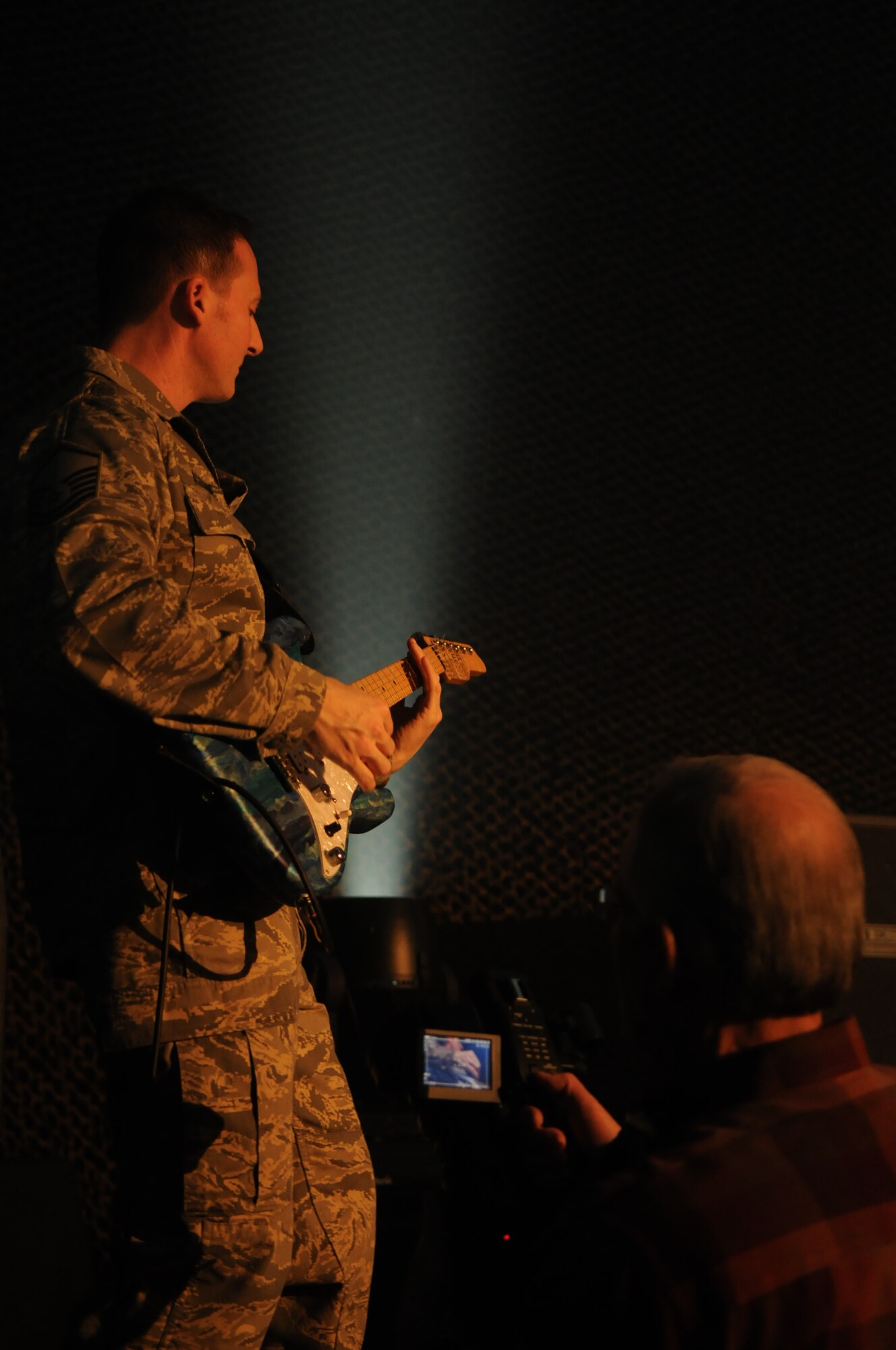 Max Impact, the United States Air Force Band’s rock group, records a video for their latest musical creation, “Locked and Loaded,” Feb. 24 at Hangar 2 on Bolling. The music video is part of Max Impact’s call “to motivate and inspire the newest generation of professional Airmen.” For more information, log on to www.usafband.af.mil. (U.S. Air Force photo by Staff Sgt. Christopher Mills)
