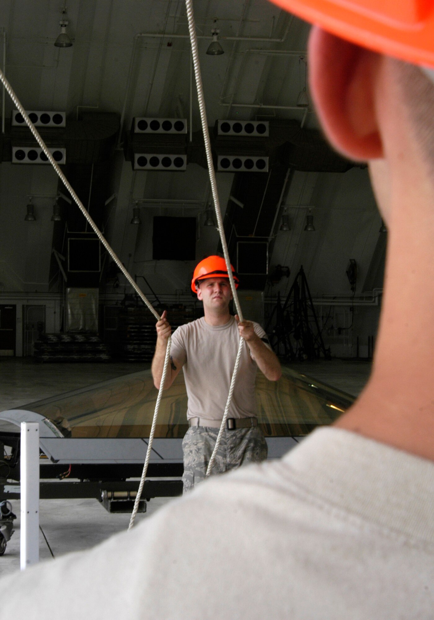 Senior Airman Ryan Ott and Staff Sgt. Tim Sullivan guide a canopy onto an F-22 Raptor at Andersen Air Force Base Feb. 18. Members of the 90th Expeditionary Fighter Squadron and the 36th Expeditionary Maintenance are deployed out of Elmendorf AFB, Alaska, with more than 250 Airmen in support of the Pacific theater security package. Sergeant Sullivan and Airman Ott are 36th Expeditionary Maintenance Squadron F-22 egress and systems specialists. (U.S. Air Force photo/Senior Airman Ryan Whitney)