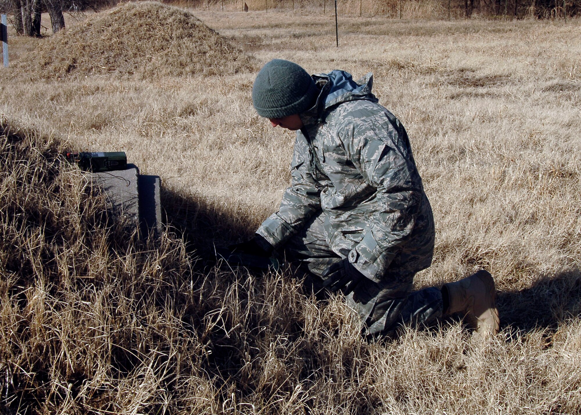 MCCONNELL AIR FORCE BASE, Kan. -- Senior Airman Dwayne Ferguson, 22nd Civil Engineer Squadron explosive ordnance disposal technician, primes C-4 in a bunker pipe. (Photo by Senior Airman Anthony Mejia)
