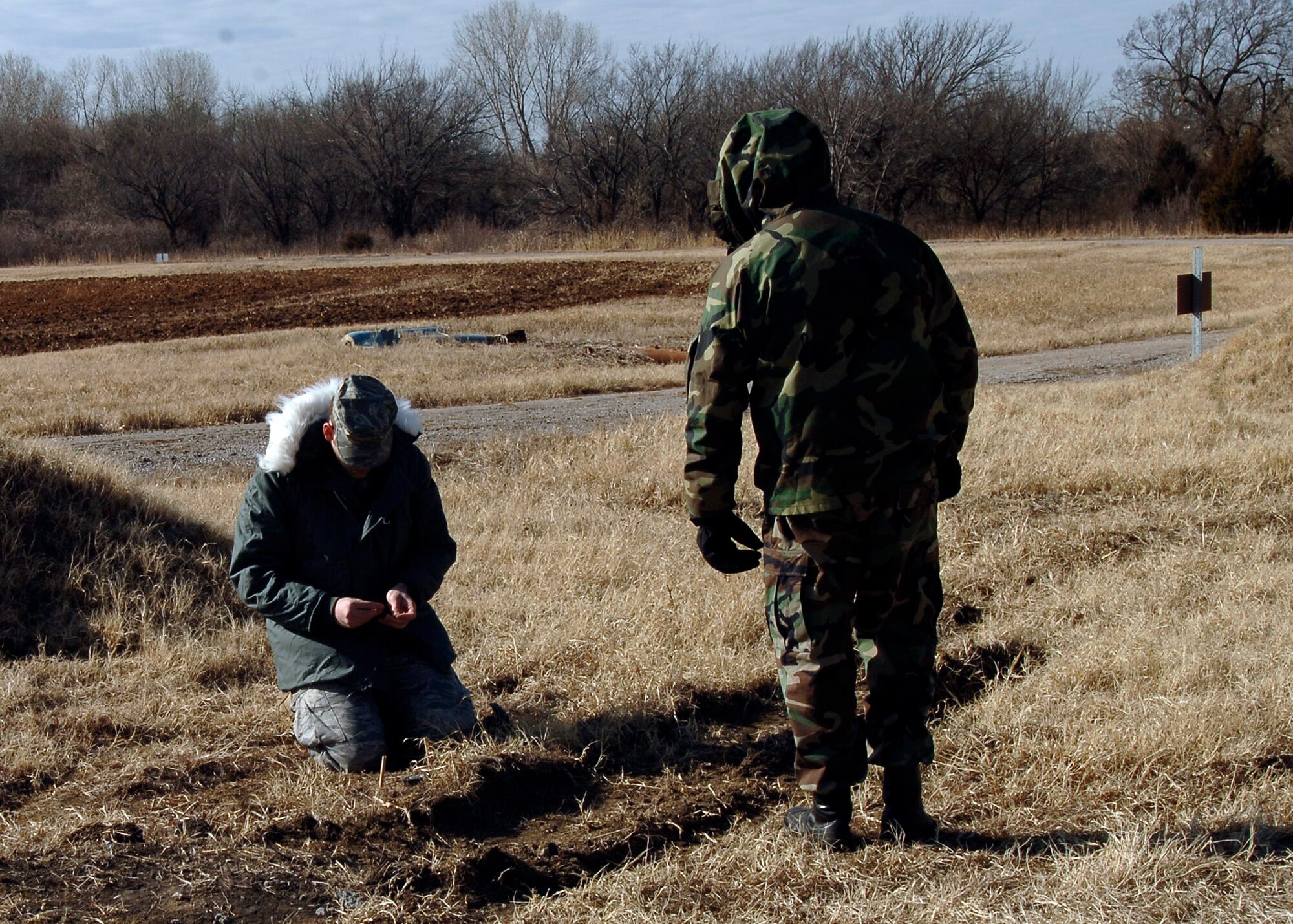 MCCONNELL AIR FORCE BASE, Kan. -- Airman 1st Class Graham Horner, 22nd Civil Engineer Squadron explosive ordnance disposal technician, preps C-4 for an explosive exercise. The C-4 must be checked and then double checked by another EOD member for proper wiring. (Photo by Senior Airman Anthony Mejia)