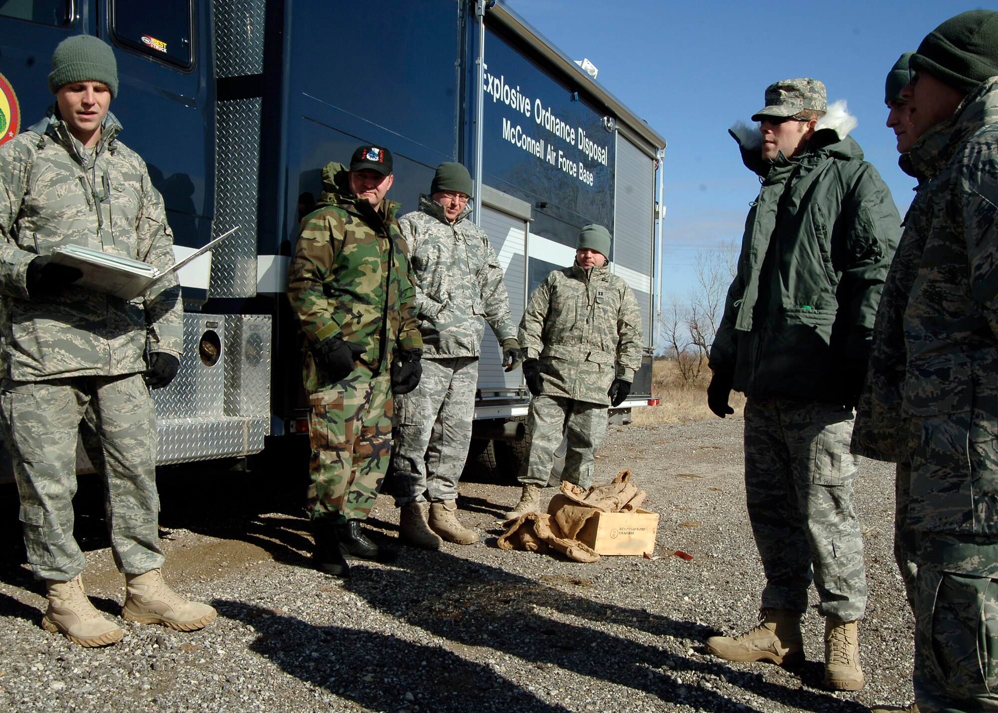 MCCONNELL AIR FORCE BASE, Kan. -- Senior Airman Dwayne Ferguson, 22nd Civil Engineer Squadron explosive ordnance disposal technician, gives a safety briefing to fellow co-workers during a training exercise. Before EOD technicians work with explosive devices, they must listen to detailed safety instructions. (Photo by Senior Airman Anthony Mejia)