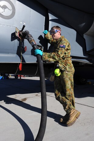 Royal Australian Air Force Cpl. Daniel Johnson, assigned to the 6th Squadron RAAF at Amberly Base, Australia, refuels a F-111 Aardvark before a RED FLAG mission at Nellis AFB, Nev., 24 Feb. Red Flag is a multi-national exercise providing a realistic environment to practice combat scenarios. The experience gained during the exercise is vital to the survival of aircrews in combat. (U.S. Air Force photo by Airman 1st Class Brett C. Clashman)