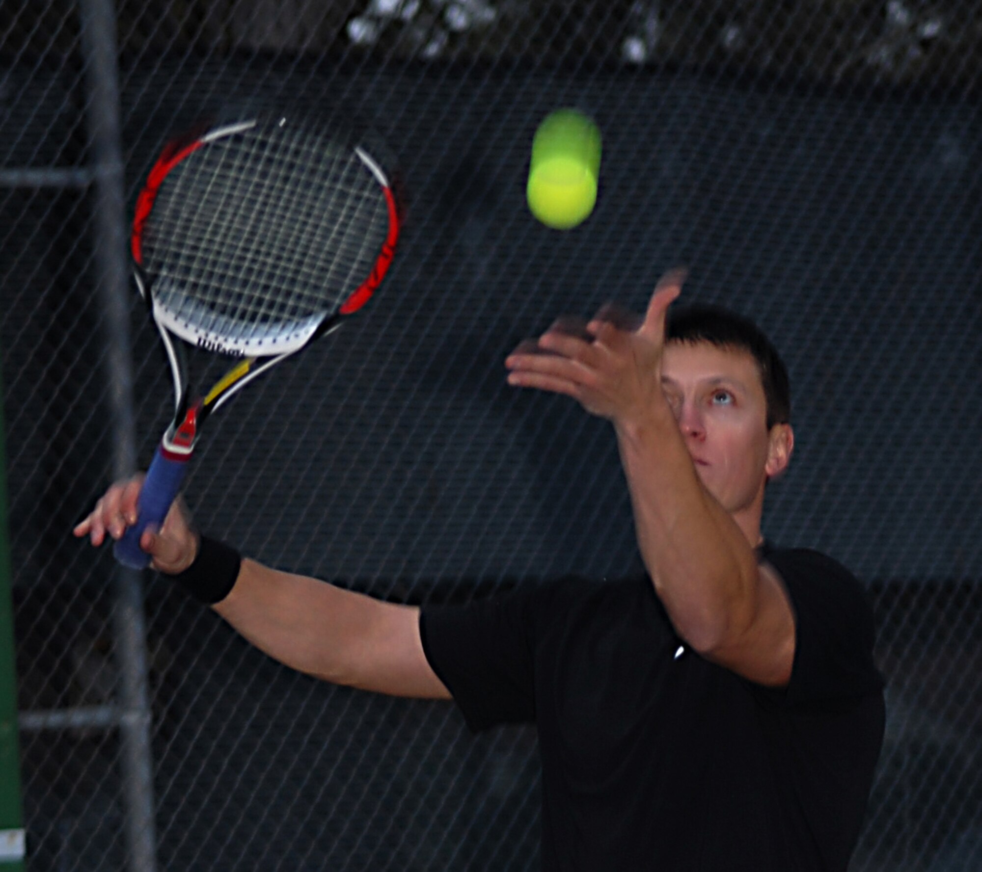 VANDENBERG AIR FORCE BASE, Calif. -- 2nd Lt. Matt Charonneau serves to his opponent during a tennis tournament sponsored by the base Fitness Center. (U.S. Air Force photo/Airman 1st Class Antoinette Lyons)