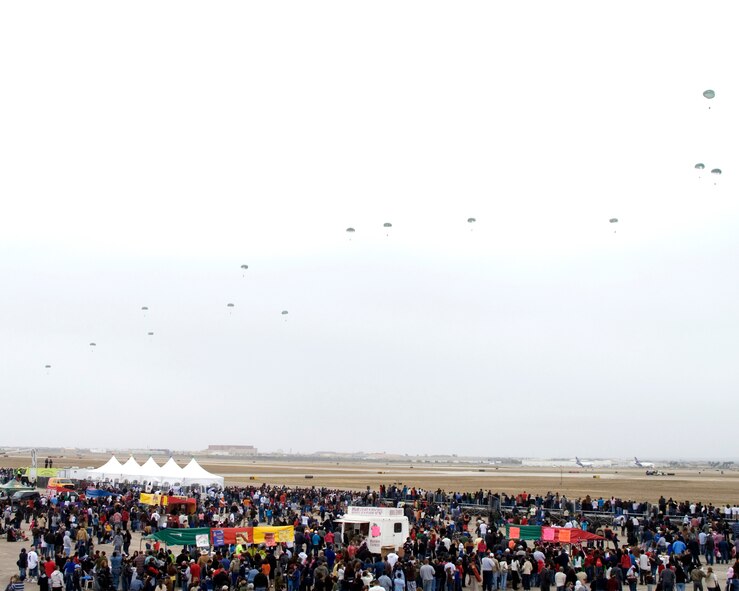 A C130H from the 136th Airlift Wing, Texas Air National Guard, drops members, performing an airborne operation, of C Company 3- 124 CAV (LRS), Texas Army National Guard, at the 11th annual Washington's Birthday Celebration Association Stars and Stripes Air Show Spectacular at the Laredo International Airport, Texas, Feb. 15, 2009.  Laredo annually celebrates Washington's birthday with a month long celebration, the largest of its kind in the United States. (USAF photo by Staff Sgt. Jennifer R. Marrs)
