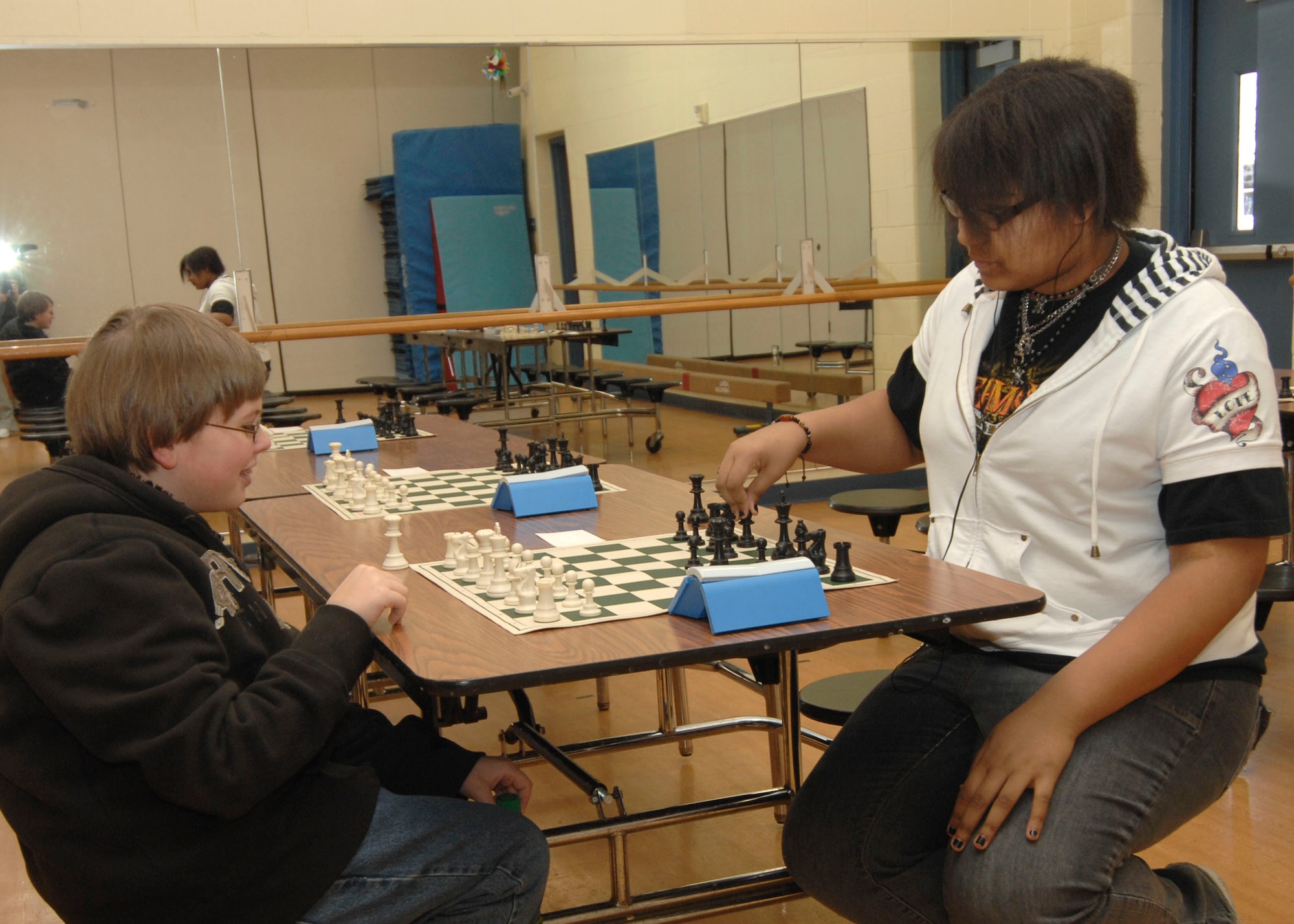 SCOTT AIR FORCE BASE, Ill. --Stephanie Chatfield concentrates as she makes her move against her opponent Alex Bialke during a chess tournament Saturday. The Scott chess tournament is held annualy for children ages 6-18 at the Base Youth Center.(U.S. Air Force photo/Tech. Sgt. Michelle Larche) 