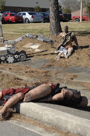 The Robot F6A locates a suspicious package
 during an exercise on Charleston AFB Feb. 23. The base conducted the exercise to test how Airmen respond to a simulated explosion caused by an improvised explosive device. The robot is used by explosive ordnance technicians to investigate and render safe improvised explosive devices from a distance. (U.S. Air Force photo/Senior Airman Katie Gieratz)