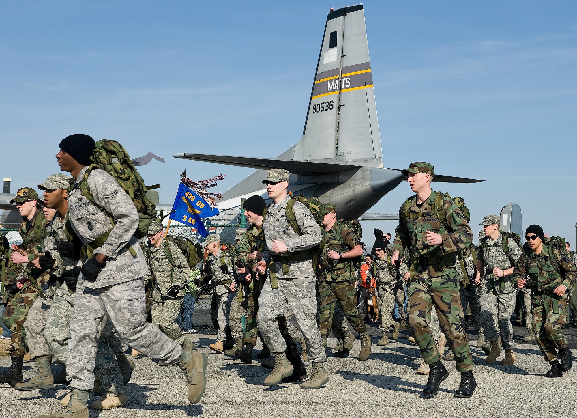 Participants begin the 10-kilometer Ruck March Feb. 21 at the Air Mobility Command Museum. (U.S. Air Force photo/ Roland Balik)