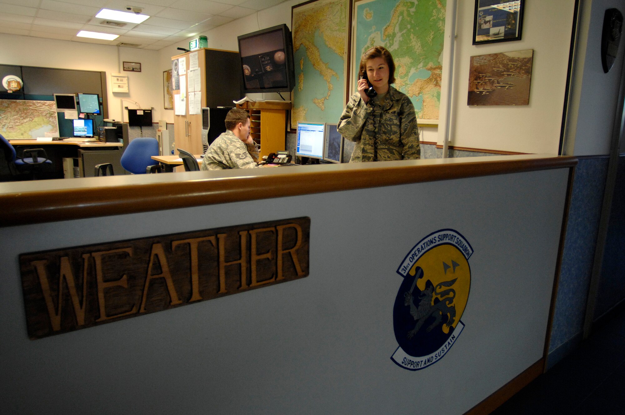 Senior Airman Eryn Morales, a 31st Operations Support Squadron weather forecaster, provides weather updates Feb. 17 to the supervisor of flying at Aviano Air Base.  The overall mission of a weather forecaster is to make a timely and accurate weather prediction.  (U.S. Air Force photo/Airman 1st Class Ashley Wood)