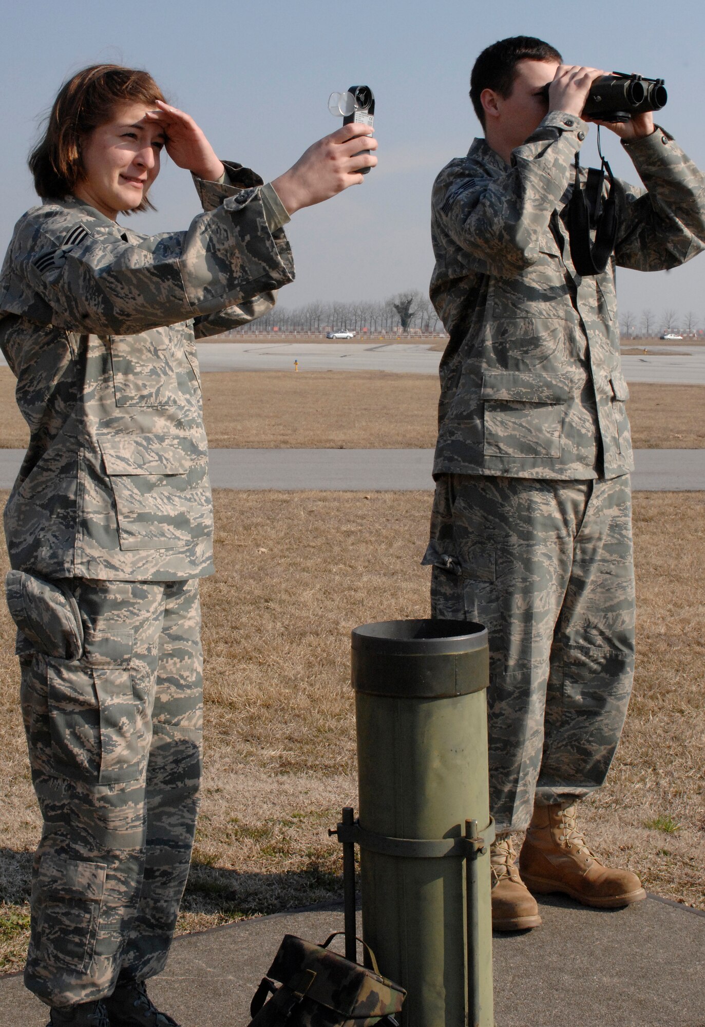 Senior Airman Eryn Morales and Staff Sgt. John Lacroix, 31st Operations Support Squadron weather forecasters, measure wind speed and check visibility distances Feb. 17 at an observation point to help ensure the safety of pilots at Aviano Air Base, Italy.  Weather forecasters check the wind speed every half hour on Fridays and visibility distances once a month or as needed.  (U.S. Air Force photo/Airman 1st Class Ashley Wood) 