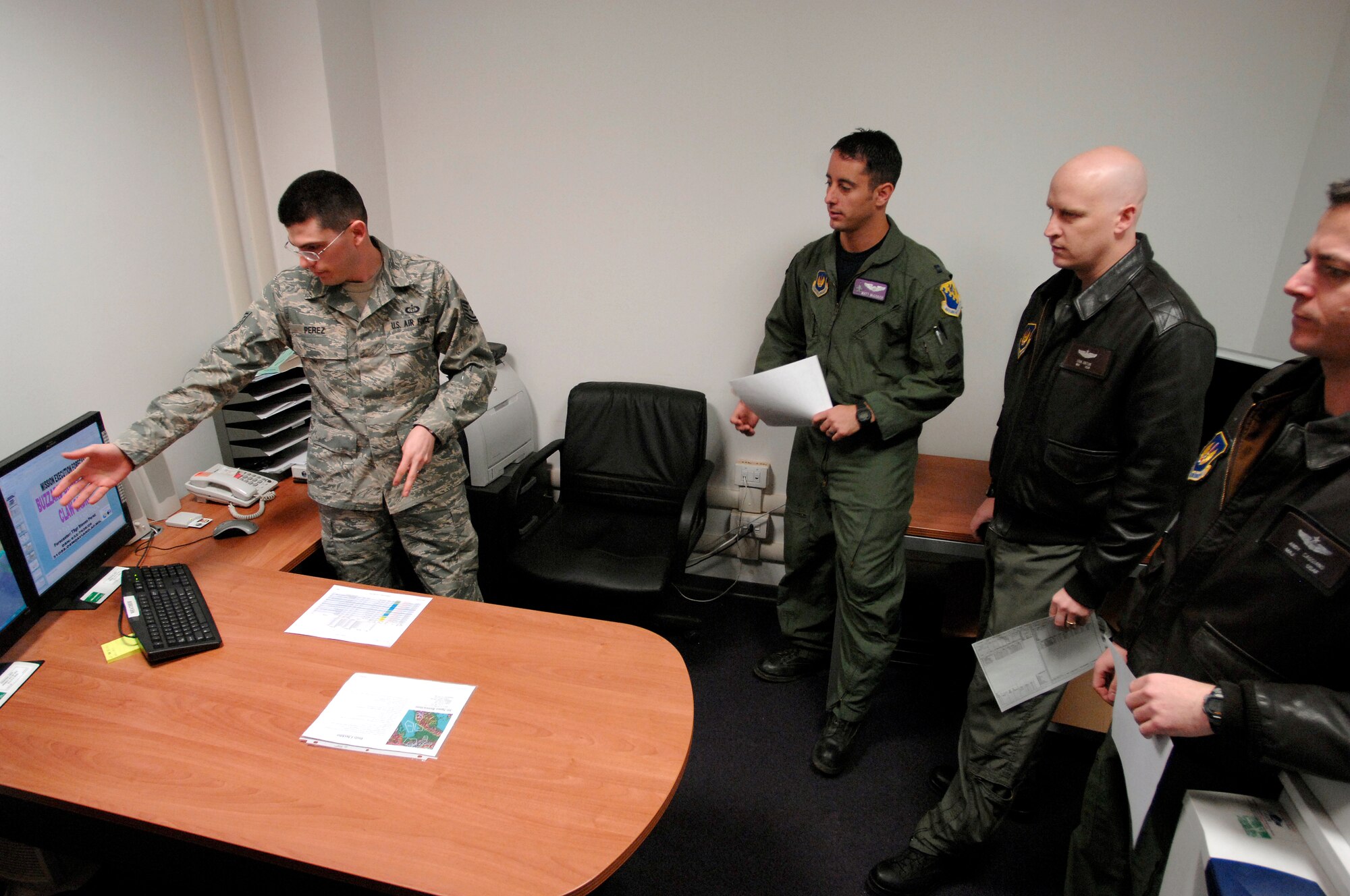 Tech. Sgt. Steven Perez, a 31st Operations Support Squadron weather forecaster, briefs pilots on weather conditions Feb. 17 prior to take-off from Aviano Air Base, Italy.   Weather forecasters are responsible for making sure the supervisor of flying is informed of the current weather conditions to determine whether or not pilots can fly that day.  (U.S. Air Force photo/Airman 1st Class Ashley Wood)