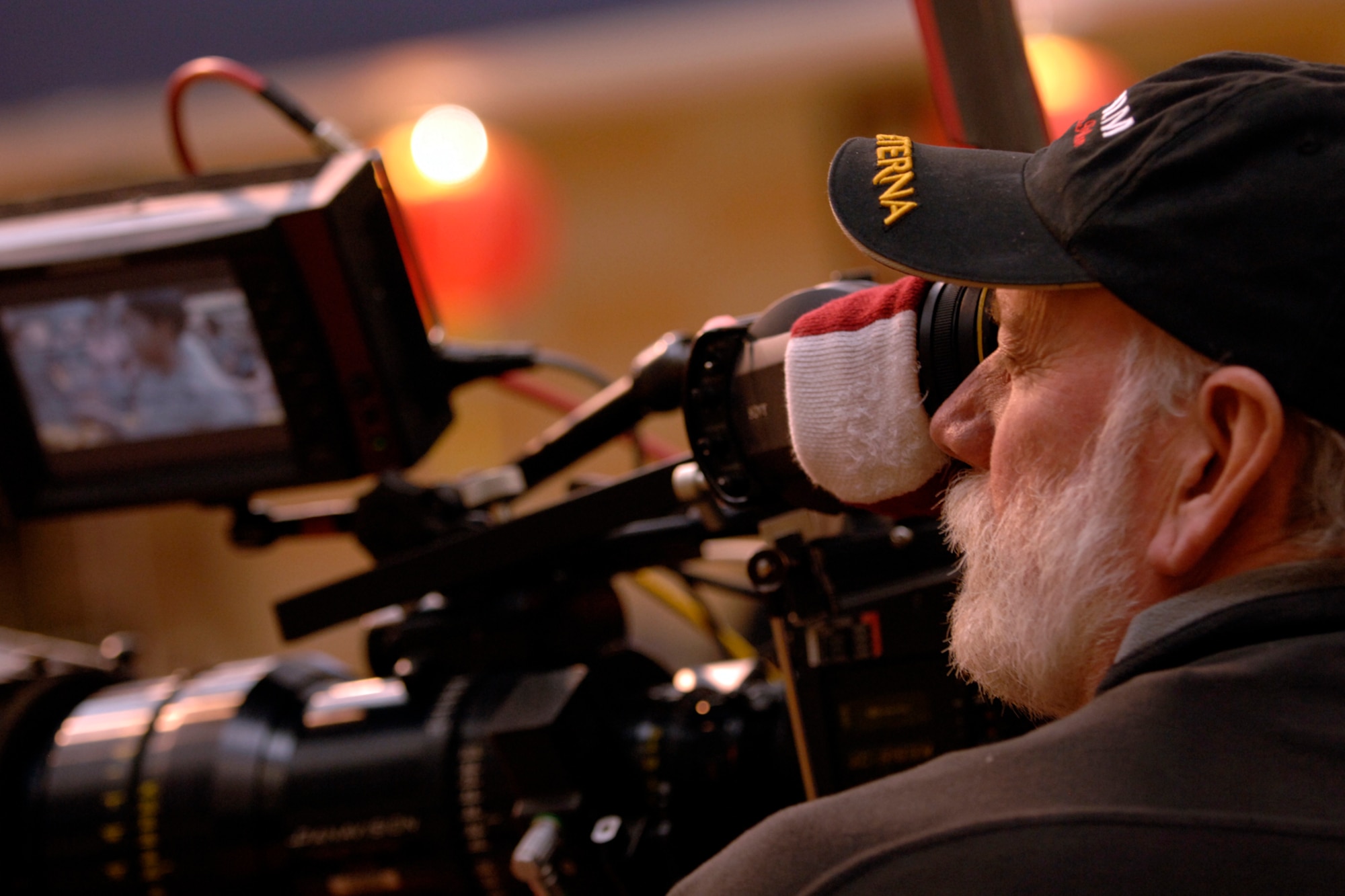 A camera man lines up his shot during the filming of an upcoming episode of the Lifetime Television show "Army Wives" at the base commissary Feb 23. In order to get a more authentic look the Department of Defense and base leadership has authorized filming at various locations. This is the second season the show has filmed here. (U.S. Air Force photo/Senior Airman Timothy Taylor)


