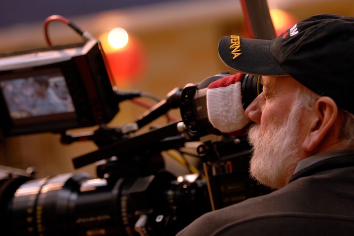 A camera man lines up his shot during the filming of an upcoming episode of the Lifetime Television show "Army Wives" at the base commissary Feb 23. In order to get a more authentic look the Department of Defense and base leadership has authorized filming at various locations. This is the second season the show has filmed here. (U.S. Air Force photo/Senior Airman Timothy Taylor)


