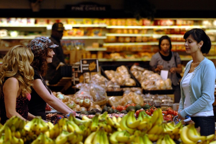Left to right, Sally Pressman, Bridgid Brannagh and Catherine Bell act out a scene for an upcoming episode of the Lifetime Television show "Army Wives" at the base commissary Feb 23. The three are actresses on the television show "Army Wives." (U.S. Air Force photo/Senior Airman Timothy Taylor)
