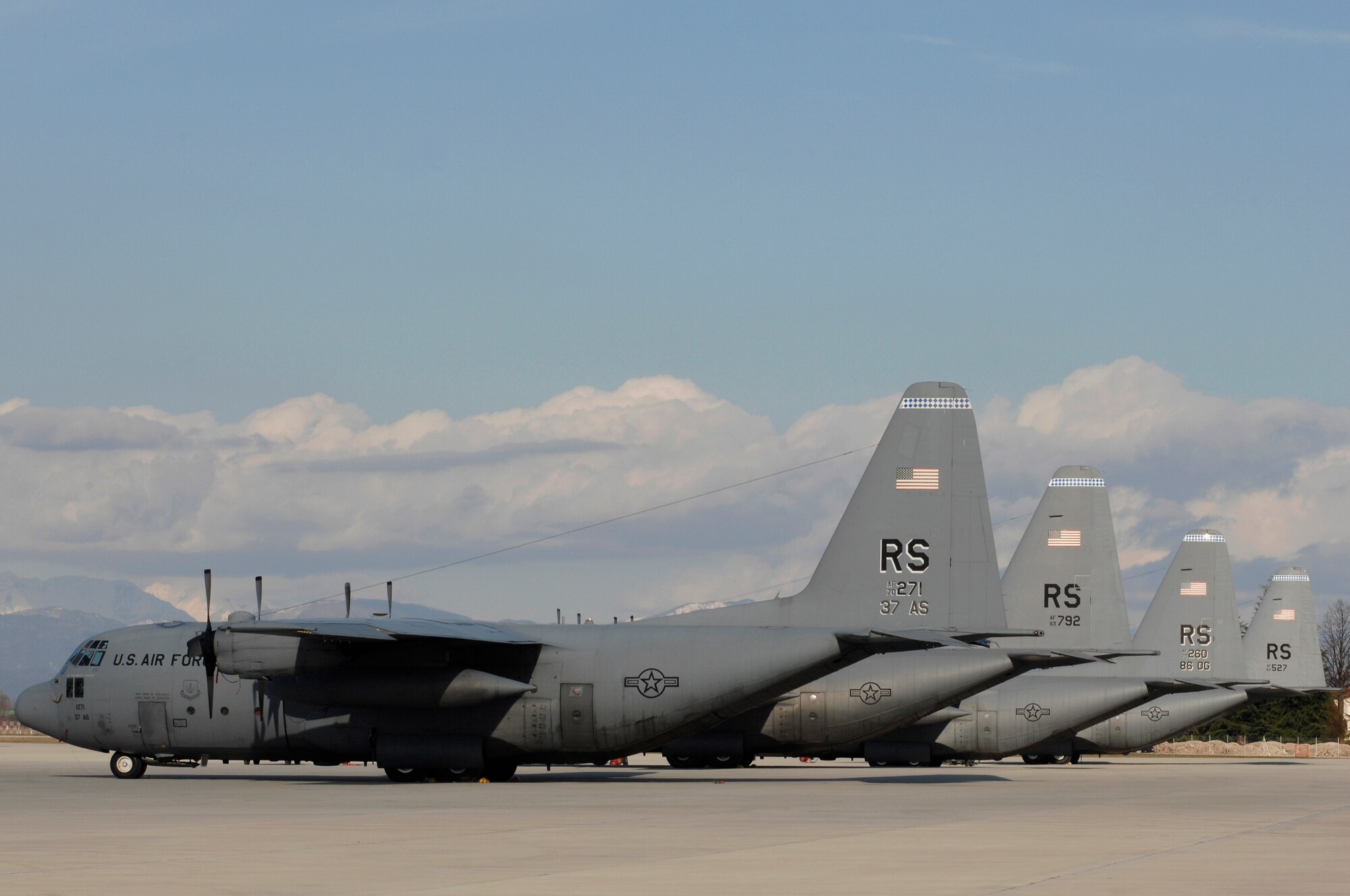 AVIANO AIR BASE, Italy: Four Air Force C-130 Hercules sit in waiting at the base of the Dolomite Mountains Feb. 9 for a contingent of Soldiers from the 173rd Airborne Brigade, referred to as jumpers.  Based out of Ramstein Air Base, Germany, the Air Force teams-up with the Army to conduct joint training several times a year to maintain Soldier profeciency in static-line jumps.  (U.S. Air Force photo/Airman 1st Class Ashley Wood)
