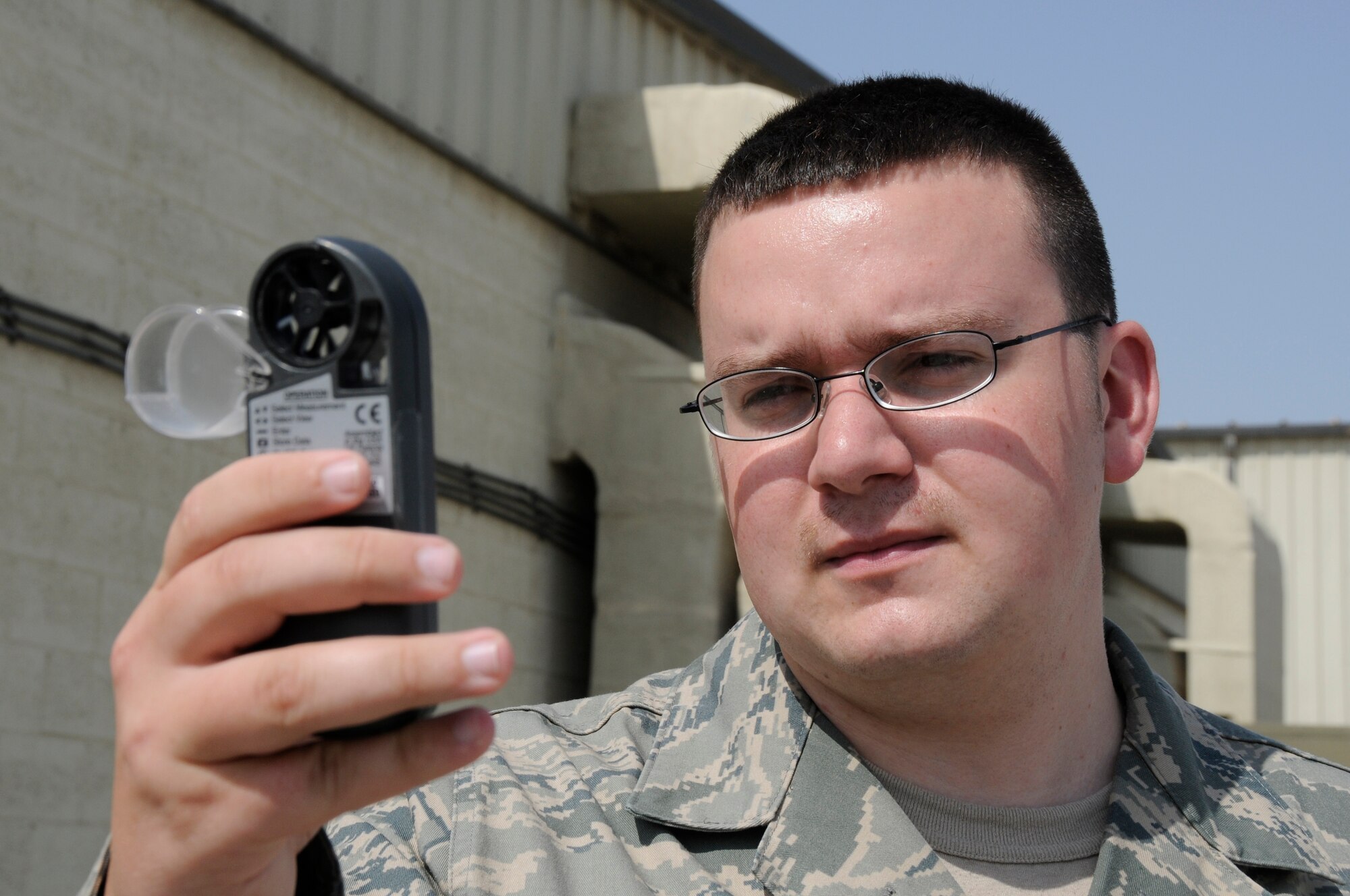 SOUTHWEST ASIA - Senior Airman Matthew Renkosiak, 380th Expeditionary Operations Support Squadron, weather flight, uses a Kestrel 4000 hand held weather system to check current conditions, Feb 23. The information gathered will be used to update slides viewed by pilots keeping them informed on weather conditions they will encounter while flying. The weather flight is responsible for keeping the base and flyers updated on current weather conditions as well as relaying to aircraft in the sky any changes that might affect their flight. Airman Renkosiak is deployed from Beale AFB, Calif. and hails from Chicago, Ill.  (U.S. Air Force photo by Senior Airman Brian J. Ellis) (Released)