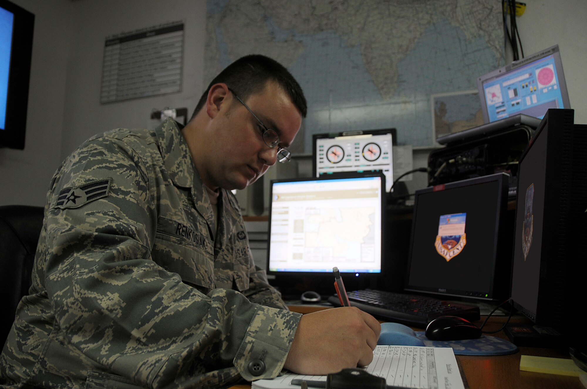 SOUTHWEST ASIA - Senior Airman Matthew Renkosiak, 380th Expeditionary Operations Support Squadron, weather flight, writes information down on a pilot-weather log, Feb 23. The log is used to keep track of all aircraft requests that call the weather flight and what weather information is relayed to the pilots. Airman Renkosiak is deployed from Beale AFB, Calif. and hails from Chicago, Ill.  (U.S. Air Force photo by Senior Airman Brian J. Ellis) (Released)