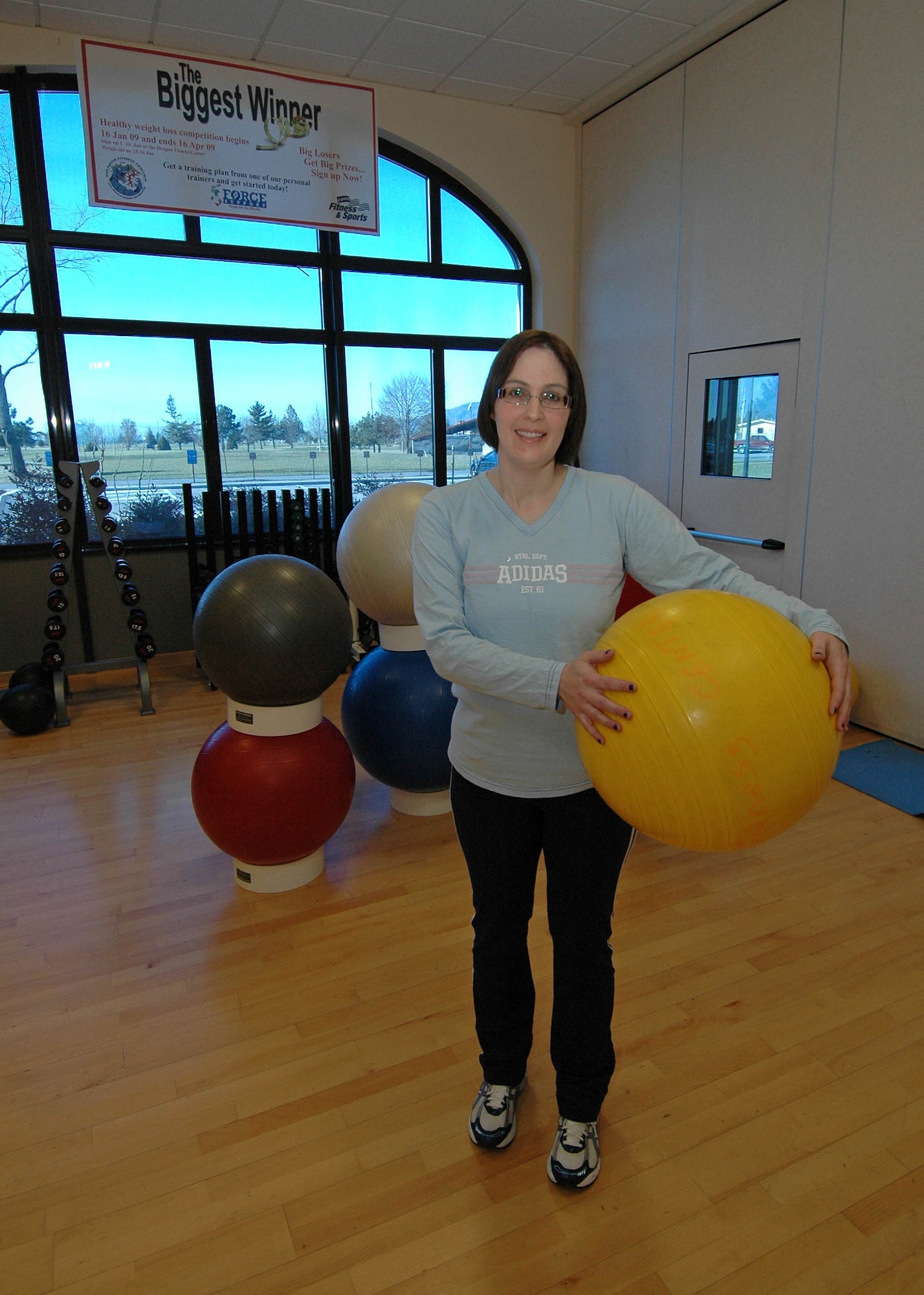 Effie Rosenblum pictured here Feb. 14 says exercising with the ball at the Aviano Air Base Dragon Fitness Center is a key element of her workout routine since she first signed up for the Aviano Biggest Winner Contest in Jan. 2008.  Rosenblum has lost 10 pant sizes since first signing up 13 months ago and is enrolled in the 2009 contest as well. (U.S. Air Force photo by/Tech. Sgt. Michael O'Connor) 