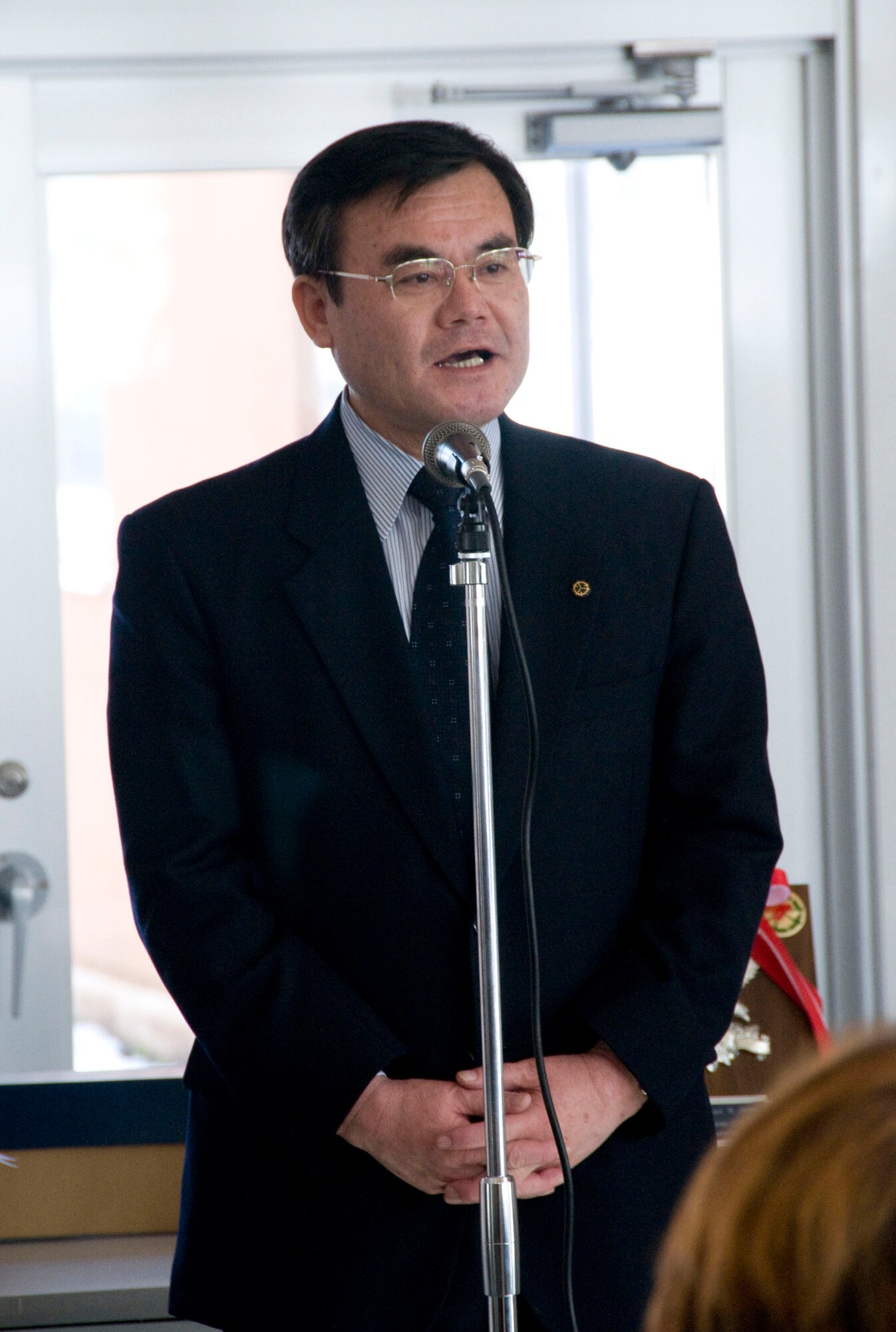 MISAWA CITY, Japan -- Misawa City Vice Mayor Kazunori Ohtsuka offers his thanks to Misawa Air Base following the Red Feather Campaign check presentation at the Misawa International Center Feb. 23, 2009. The check, totaling more than $8,000, will help the Misawa Red Feather Community Chest provide assistance to under-privileged children, elderly, and handicapped citizens of Misawa City. (U.S. Air Force photo by Staff Sgt. Samuel Morse)