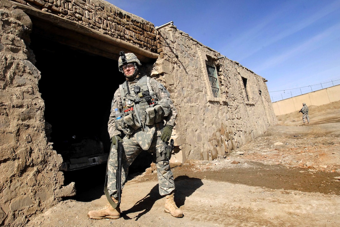 U.S. Army Sgt. 1st Class Jason Schultz provides perimeter security at the site of an old prison in Paktia province, Afghanistan, as Paktia Provincial Reconstruction Team members tour the area Feb. 11, 2009. Schultz, a platoon sergeant, is assigned to 1st Battalion, 178th Infantry Regiment.