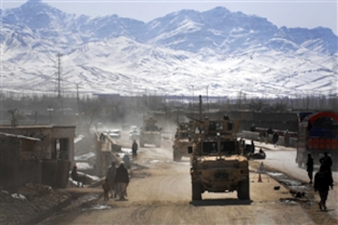 U.S. Army soldiers drive a convoy into Gardez City, Afghanistan, the Paktia provincial capital, to meet with local officials, Feb. 17, 2009. The soldiers are assigned to 1st Battalion, 178th Infantry Regiment.
