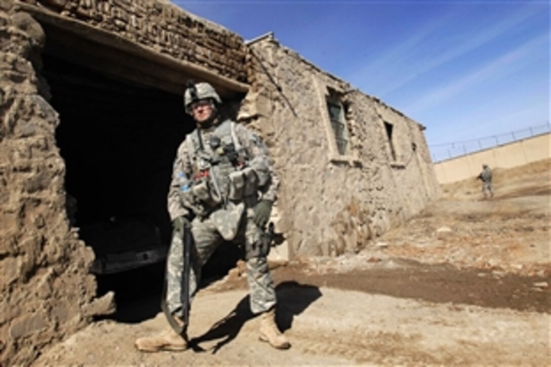 U.S. Army Sgt. 1st Class Jason Schultz provides perimeter security at the site of an old prison in Paktia province, Afghanistan, as Paktia Provincial Reconstruction Team members tour the area Feb. 11, 2009. Schultz is a platoon sergeant with the 1st Battalion, 178th Infantry Regiment.
