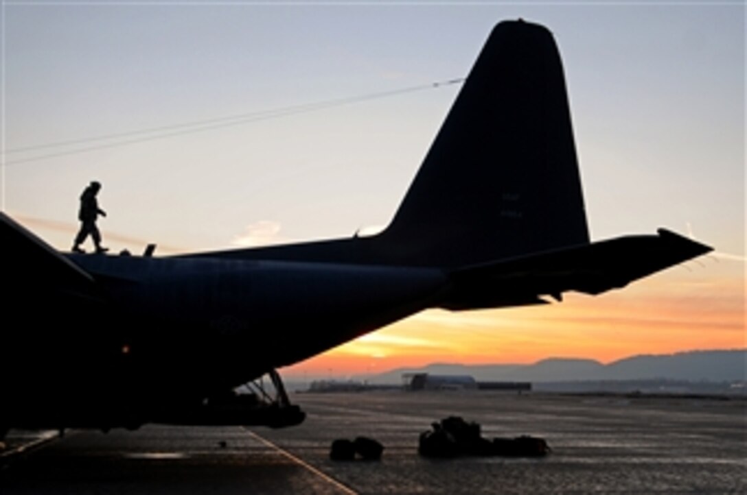 A U.S. Air Force airman inspects a C-130 Hercules aircraft at Ramstein Air Base, Germany, on Feb. 18, 2009.  