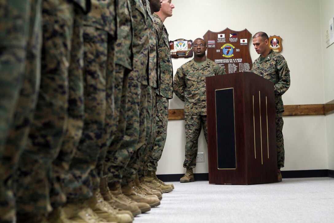 Lt. Col. Carlos Urbina, far right, commanding officer, 7th Communication Battalion, 3rd Marine Division, III Marine Expeditionary Force, and acting company first sergeant, Gunnery Sgt. Jeffrey Lee, Headquarters Company, 7th Comm. Bn., deliver a presentation at a dedication Nov. 10 for 1st Lt. Michael Johnson. Johnson was posthumously awarded a Bronze Star with combat distinguishing device for actions in Ganjgal Valley, Afghanistan while serving with Embedded Training Team 2-8 and 1st Kandak, 2nd Brigade, 201st Corps, Afghan National Army, as an advisor and mentor.