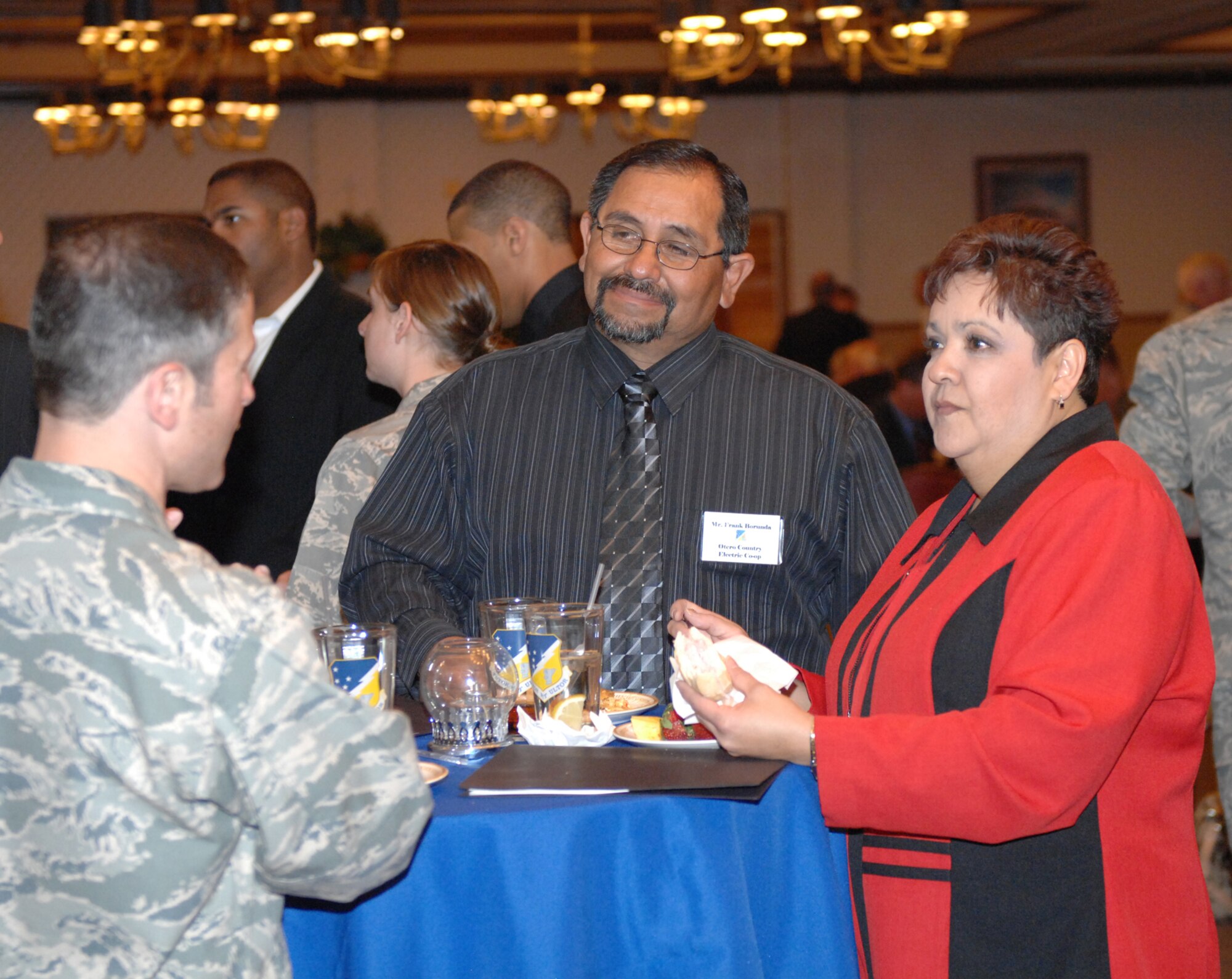 49th Aircraft Maintenance Squadron Commander Lt. Col. Steven James discuss the F-22A with Mr. Frank Borunda and his wife, Pat. Mr. Borunda is the member services advisor for Otero County Electric Co-op and is Colonel James? honorary commander. The honorary commanders will have the opportunity to tour Holloman in March as they take part in a base tour which will include a driving tour at BEAR Base, an F-22 launch and a stop at the German Air Force Flying Training Center. (U.S. Air Force photo/Senior Airman Russell Scalf)