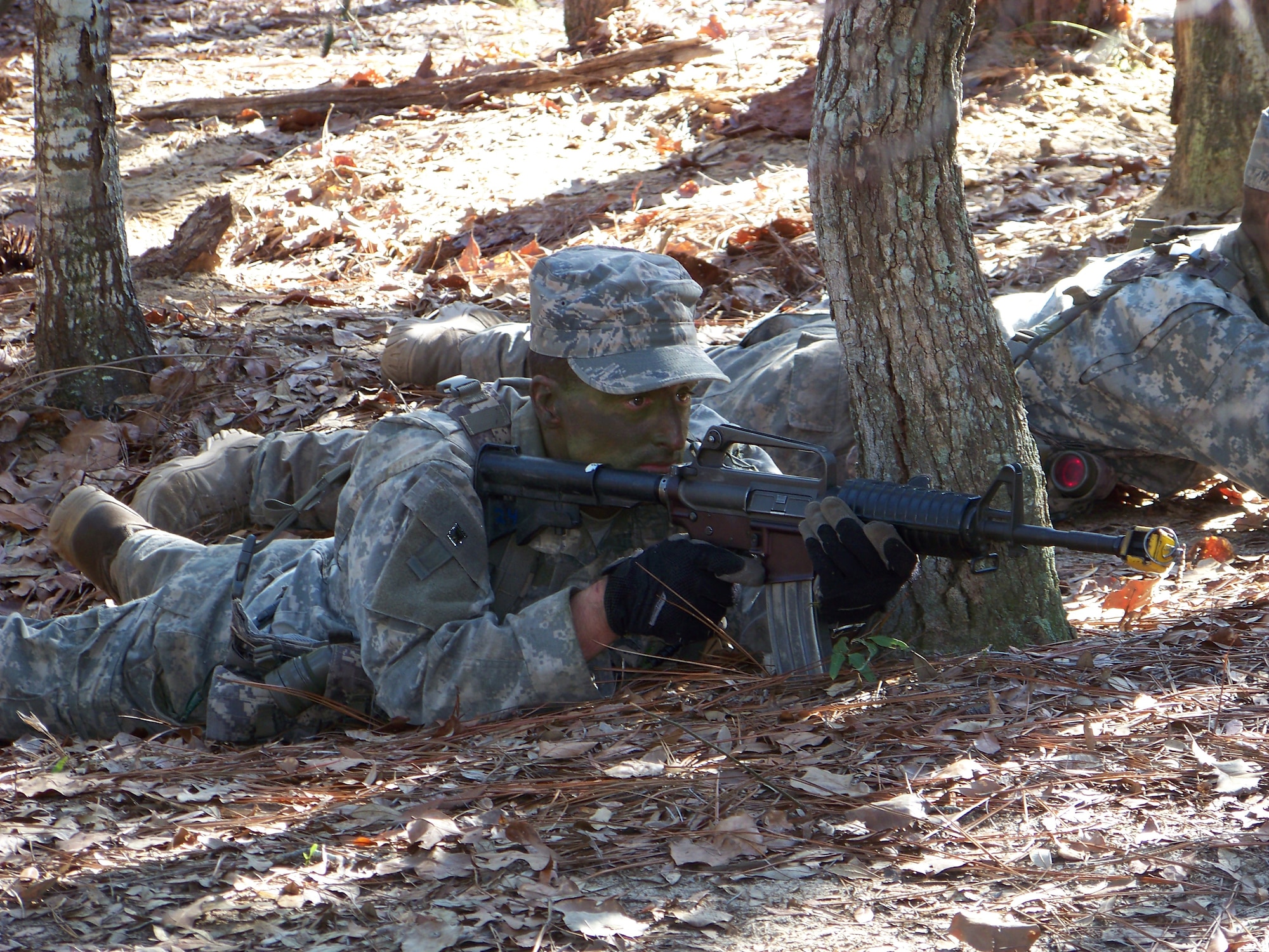 HURLBURT FIELD, Fla. -- Airman 1st Class Thiago Barosa, a 342nd Training Squadron tactical air control party student lies in the prone position with his weapon while awaint further instructions during a portion of field training here, Feb. 12. TACPs act as a liaison between U.S. Army ground maneuver units and Air Force pilots. (U.S. Air Force photo by Staff Sgt. Mareshah Haynes)
