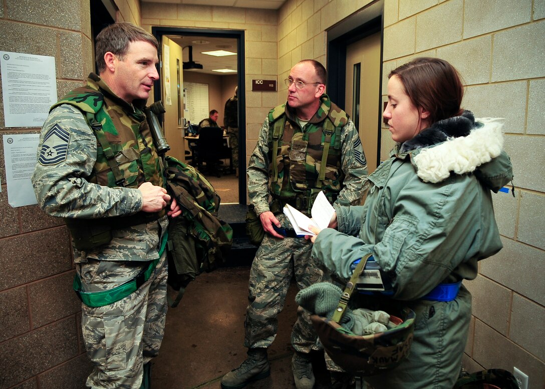 Chief Master Sgt. Tim Flock, 141 ARW Deployed Forces Command Chief, and Chief Master Sgt. Dan Wells, 92 ARW Deployed Forces Command Chief, interviewed by Senior Airman Kali Gradishar, 92 ARW Public Affairs, about their roles in the recent exercise. (Photo by Senior Airman Joshua Chapman, 92 ARW Public Affairs)