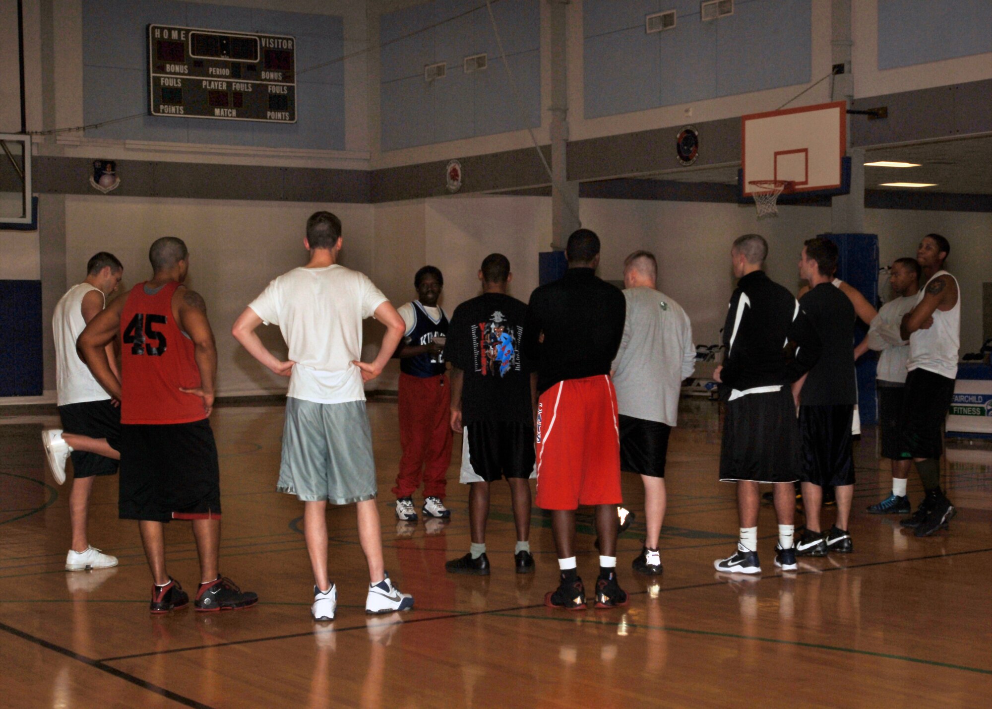 Fairchild Varsity basketball team hopefuls listen intently to the rules of trying out, given by Steven Pitters at the Fitness Center Feb. 25.
Try-outs are being held for the Fairchild Varsity basketball team through Feb. 27, as well as March 2 and 3, from 6 to 8 p.m. Active-duty members have top priority for try-outs, but civilians are welcome to give it a shot as well. 
For those interested in trying out, a completed Air Force Form 303 must be brought to the try-outs. 
One of the goals of the Varsity team is to compete against other local teams and eventually other Air Force Bases, Sergeant Smith said.
Try-outs will also be held later in the year for softball, volleyball and soccer.
For more information, contact Sergeant Smith at 247-2791. (U.S. Air Force photo/Senior Airman Emerald Ralston)
 