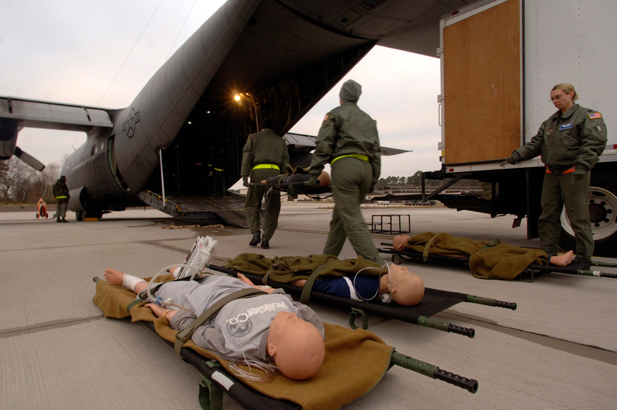 Flight nurses and medical technicians load 1,500 pounds of medical equipment and training mannequins into a C-130 Hercules shortly before takeoff on a weekly recurring training sortie for personnel assigned to the 86th Aeromedical Evacuation Squadron Feb. 19 at Ramstein Air Base, Germany. The flight-qualified healthcare providers fly with the 37th Airlift Squadron to remain proficient in their skills. (Defense Department photo/Master Sgt. Scott Wagers) 
