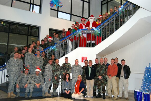 Members of the 134th Security Forces Squadron pose for a photo during their annual "Santa's Cops" visit to the East Tennessee Children's Hospital. (Air National Guard Photo by Staff Sgt. Lindsey Watson-Kirwin)