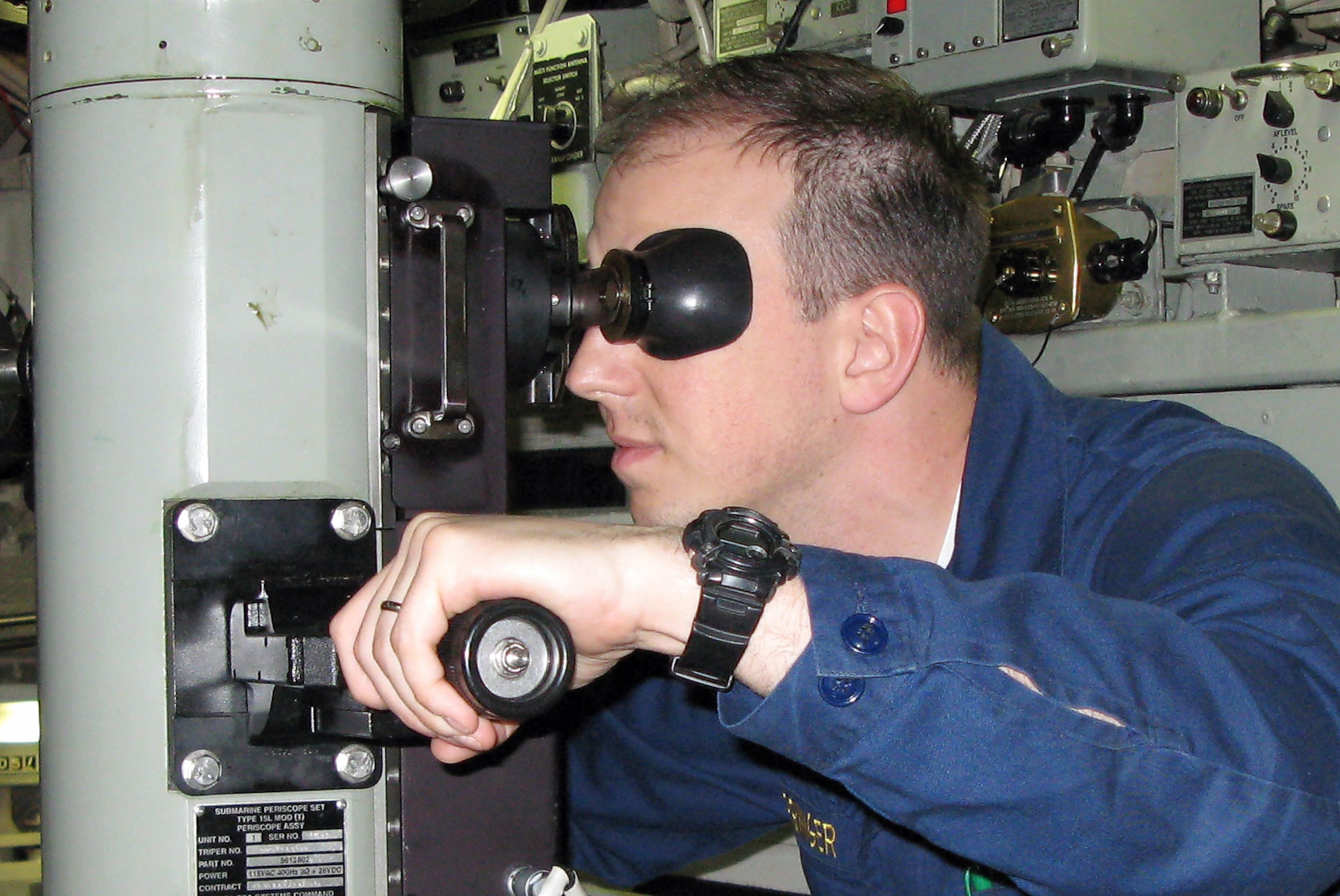 The USS Maryland's "Gold" crew executive officer, Navy Lt. Cmdr. Louis J. Springer, takes a look through the vessel's periscope Feb. 17.  (Department of Defense photo/Gerry J. Gilmore)
