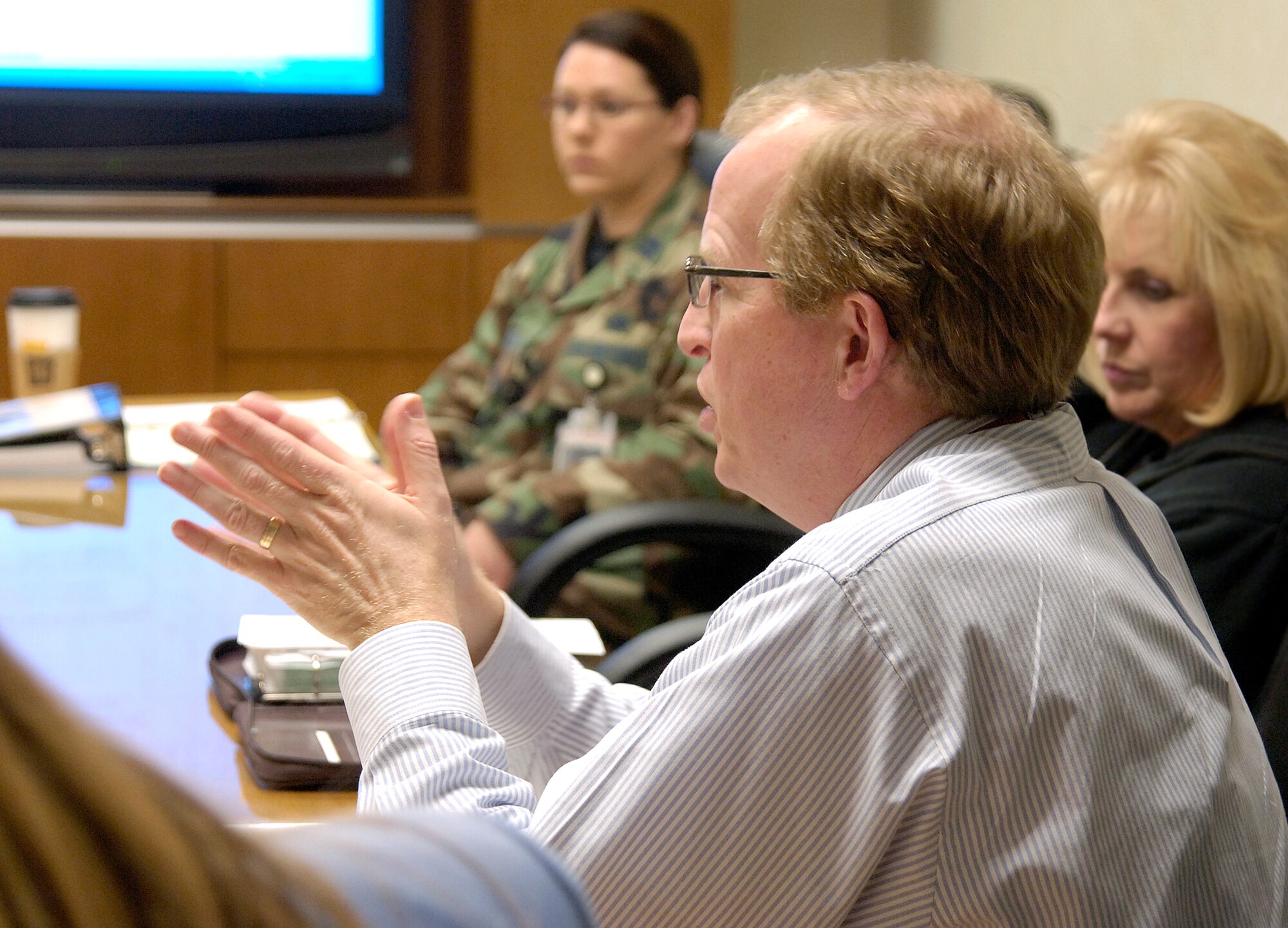 Chief of the Oklahoma City Air Logistics Center’s Test Authority, Dan Llewelyn, reviews checklists and processes with members of the 327th Aircraft Sustainment Group during a recent no-notice inspection.  (Air Force photo/Margo Wright)