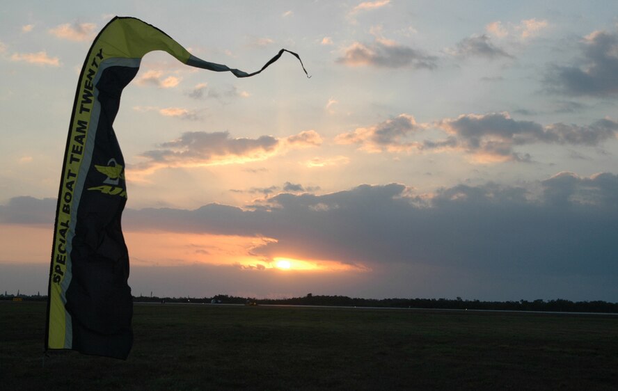 A Special Boat Team 20 marker flaps in the Florida wind Feb. 26, 2009, as the sun rises over Naval Air Station Key West. The marker represents the drop zone for members of the U.S. Navy special forces team who performed refresher training on high-altitude, low-opening, or 'HALO' jumps from the back of a C-130 Hercules. The C-130 aircrew is based out of Peterson Air Force Base, Colo., and assigned to the Air Force Reserve Command's 302nd Airlift Wing. (U.S. Air Force photo/Senior Airman Stephen Collier) 
