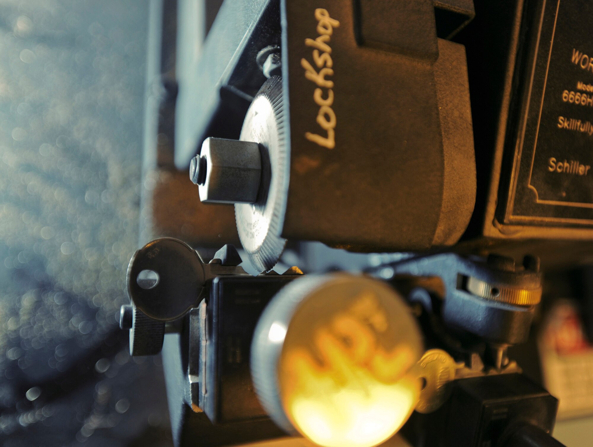 An automatic key cutting machine clones a key Feb. 25 in the 379th Expeditionary Civil Engineer Squadron locksmith shop at an air base in Southwest Asia. The machine uses a feeler gauge to run along the original key's edge which tells the cutting wheel where to cut the blank in order to make an exact duplicate key. (U.S. Air Force photo/Staff Sgt. Joshua Garcia) 

